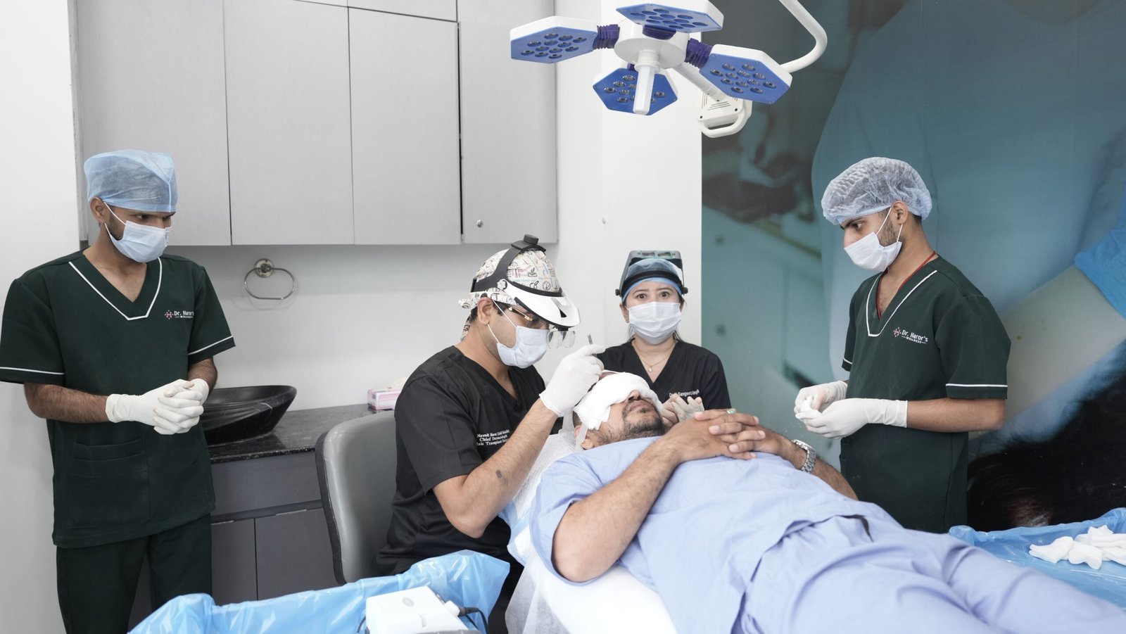 Medical team performing a hair transplant procedure in a professional clinic